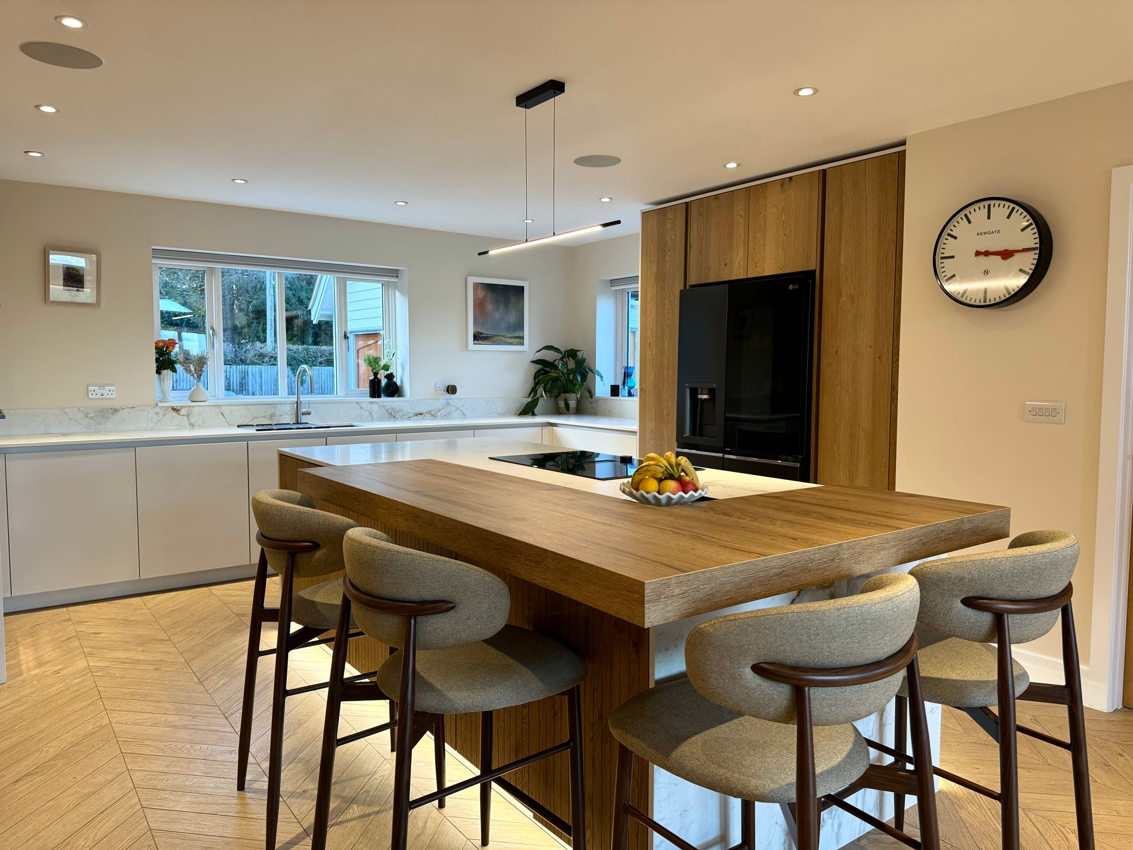 A Luxury Bespoke Kitchen Featuring a Statement Island and Fluted Oak Detailing