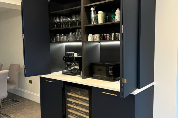 Bespoke kitchen bar and coffee station with concealed storage, wine cooler and quartz worktops